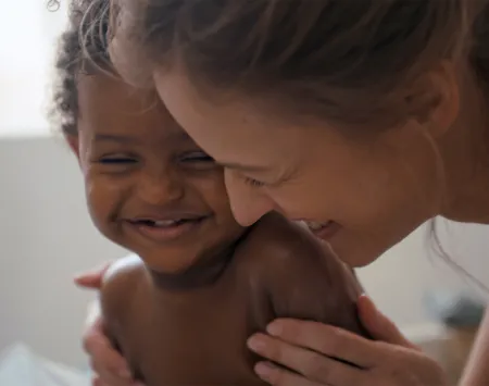 Woman and her child smiling 